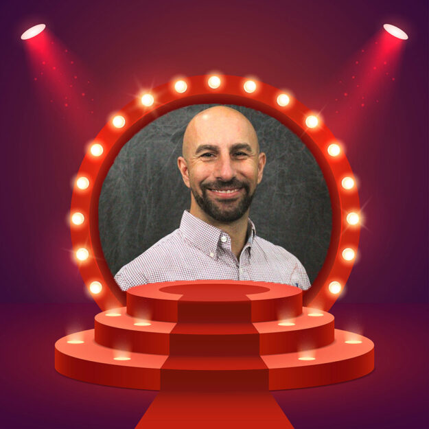 Vic Kerasimian profile picture in a theater frame.