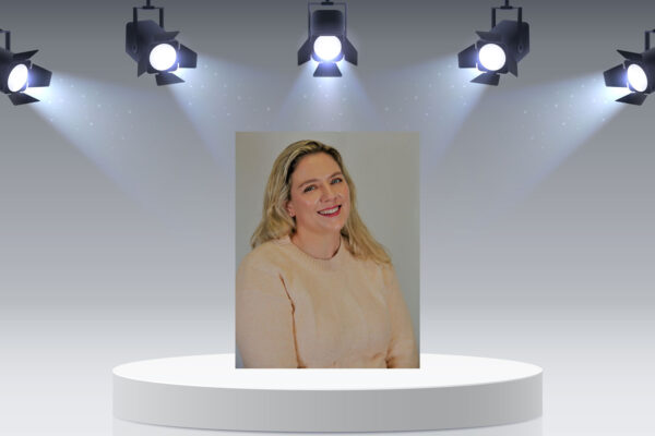 Chelsea Jones profile picture on podium with lights.