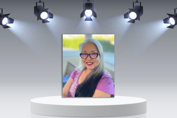 Karie Horie profile picture on podium with lights.