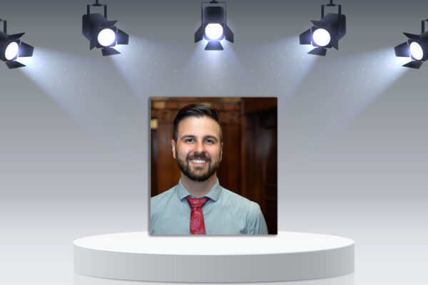 Tyler Zikuski profile picture on podium with lights.