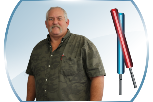 David Lamb standing with Star Wars like sabers.