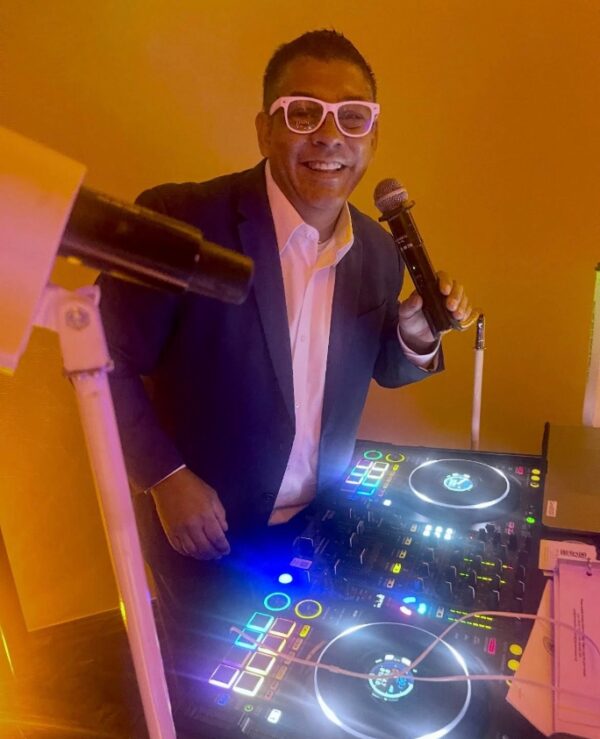 John Villa behind his DJ console.