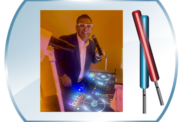 John Villa behind his DJ console with Star Wars like sabers.